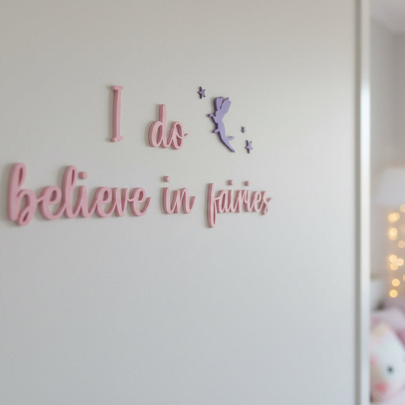 Wall with text 'I do believe in fairies' and a fairy silhouette.