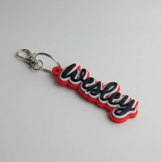 Keychain with 'Wesley' text on a light gray background