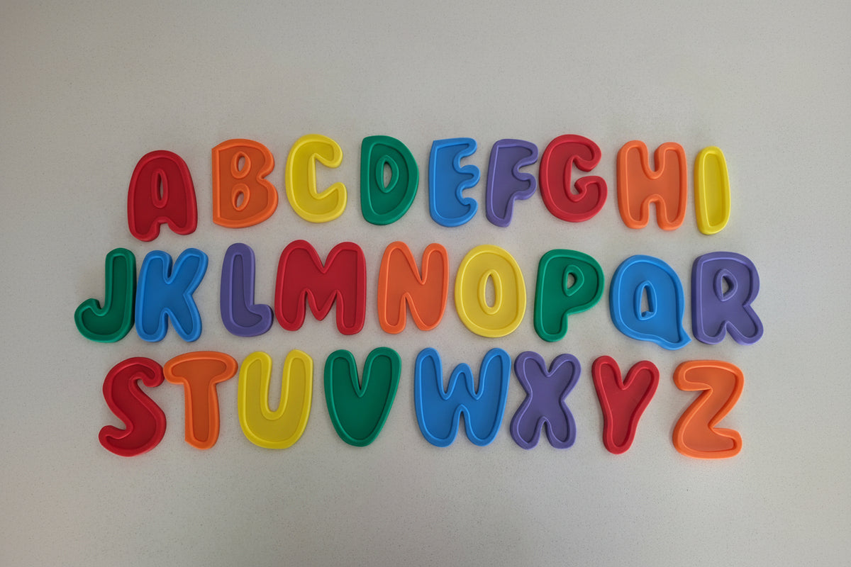 Colorful alphabet letters on a light gray background
